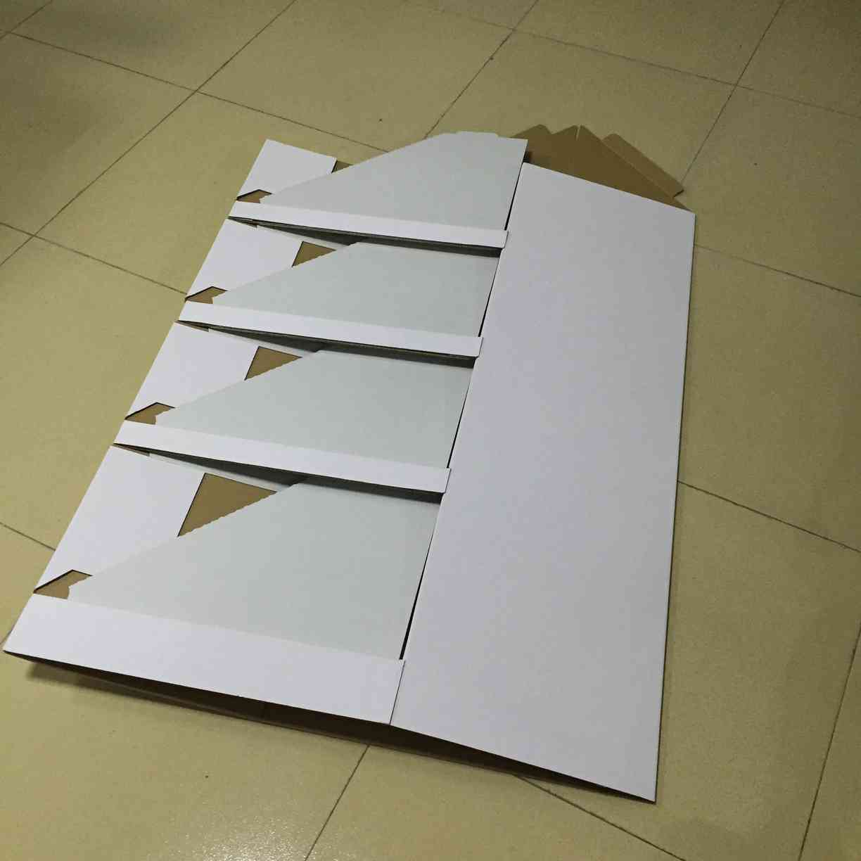 Holidaypac archive reference showing folded cardboard display components before packing